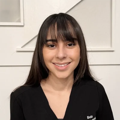 Chiropractic Allen TX Isabella DiDonato Isabella DiDonato smiling in a black shirt.
